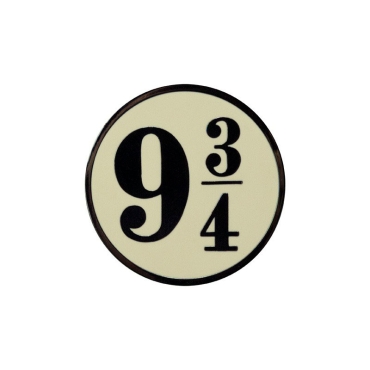 Hogwarts suitcase pin attached to a backpack